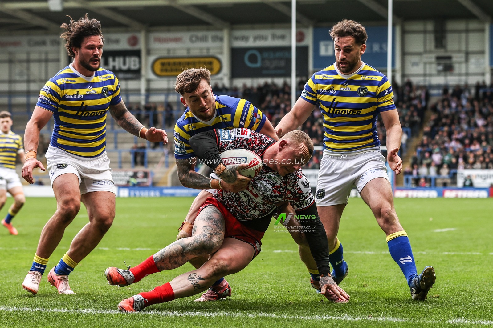 Josh Charnley of Leigh Leopards is tackled by Matty Ashton of Warrington Wolves and Toby King of Warrington Wolves during the Betfred Super League round 7 match Warrington Wolves vs Leigh Leopards at The Halliwell Jones Stadium, Warrington, United Kingdom on 04 April 2026

(Photo by Alfie Cosgrove/News Images)