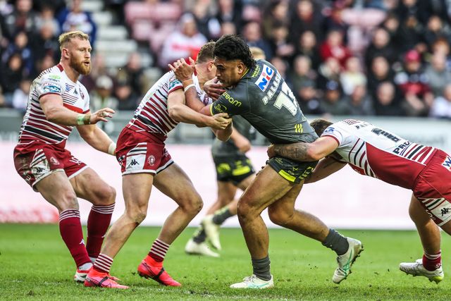 Keenan Palasia of Leeds Rhinos is tackled by Oliver Partington of Wigan Warriors during the Betfred Super League round 11 match Wigan Warriors vs Leeds Rhinos at The Brick Community Stadium, Wigan, United Kingdom on 15 May 2026

(Photo by Alfie Cosgrove/News Images)
