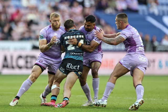 Bailey Hodgson of Leigh Leopards is tackled by Luke Thompson of Wigan Warriors and Bevan French of Wigan Warriors during the Betfred Super League Round 11 match Wigan Warriors vs Leigh Leopards at The Brick Community Stadium, Wigan, United Kingdom, 16th May 2025

(Photo by Mark Cosgrove/News Images)