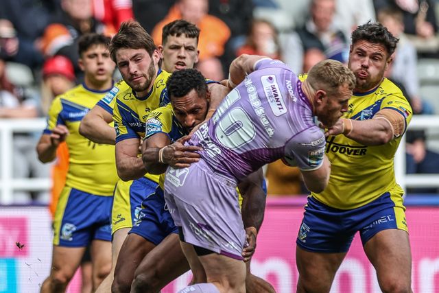 Luke Thompson of Wigan Warriors is tackled by Joe Philbin of Warrington Wolves, Zane Musgrove of Warrington Wolves and Adam Holroyd of Warrington Wolves during the Betfred Magic Weekend 2025 match Wigan Warriors vs Warrington Wolves at St. James's Park, Newcastle, United Kingdom, 4th May 2025

(Photo by Mark Cosgrove/News Images)
