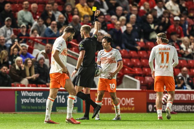 Referee Jamie O'Connor gives a yellow card to George Honeyman of Blackpool during the Sky Bet League One match Barnsley vs Blackpool at Oakwell, Barnsley, United Kingdom on 02 September 2026

(Photo by Alfie Cosgrove/News Images)