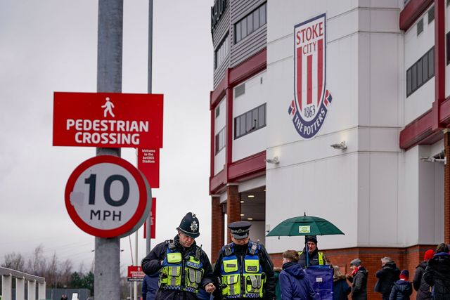 Two police officers walk past the Stoke City badge on the walls of the stadium prior to kick off during the Emirates FA Cup 4th Round  match Stoke City vs Fulham at Bet365 Stadium, Stoke On Trent, United Kingdom on 15 February 2026

(Photo by Maynard Manyowa/News Images)