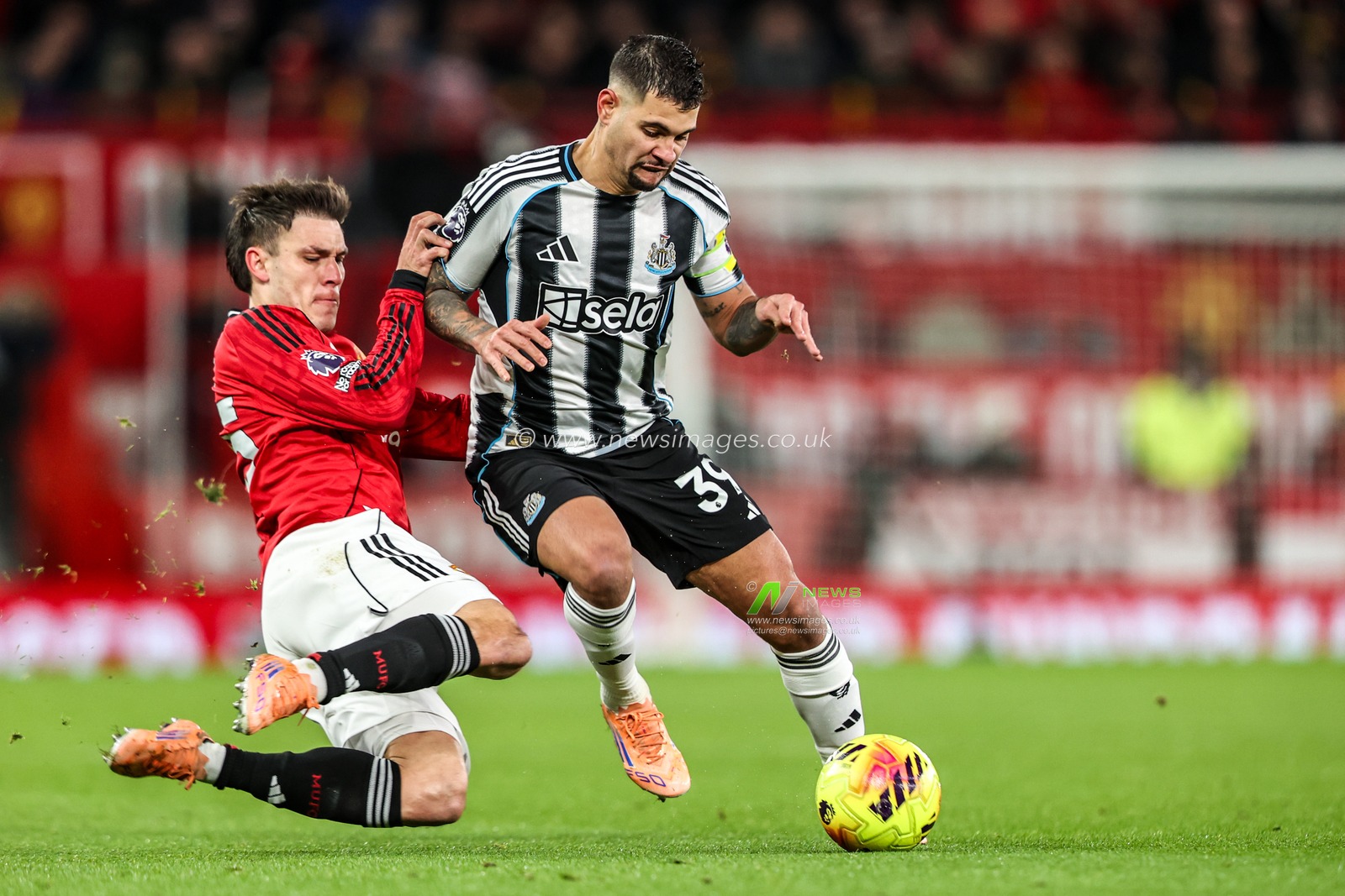 Bruno Guimaraes of Newcastle United is tackled by Manuel Ugarte of Manchester Untied during the Premier League match Manchester United vs Newcastle United at Old Trafford, Manchester, United Kingdom, 26th December 2025

(Photo by Alfie Cosgrove/News Images)

*** GER AUT SUI OUT ***