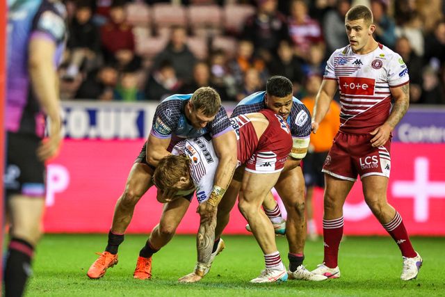 Adam Keighran of Wigan Warriors is tackled during the Betfred Super League match Wigan Warriors vs Hull FC at The Brick Community Stadium, Wigan, United Kingdom on 21 February 2026

(Photo by Alfie Cosgrove/News Images)