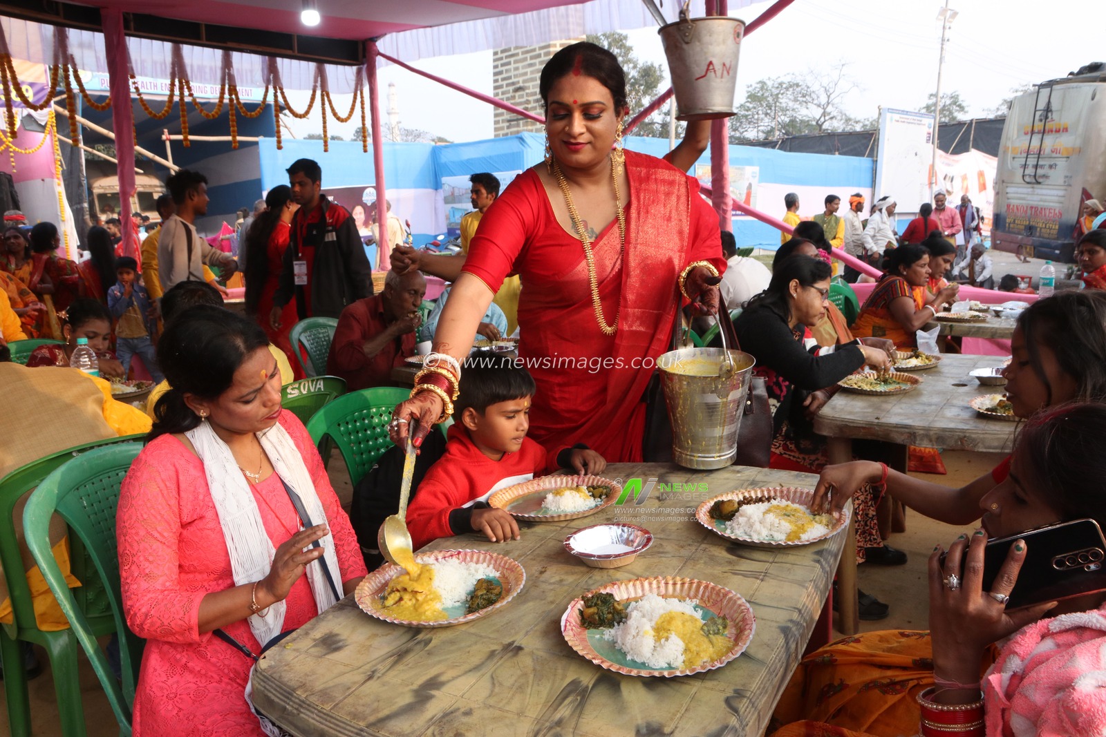 Indian transgender individuals distribute free food to Hindu pilgrims at a camp organized by a social organization run by the transgender community at the transit camp on their way to Gangasagar in Kolkata, India, on January 11, 2025. Pictures by Debajyoti Chakraborty.(Photo: Debajyoti Chakraborty/News Images)