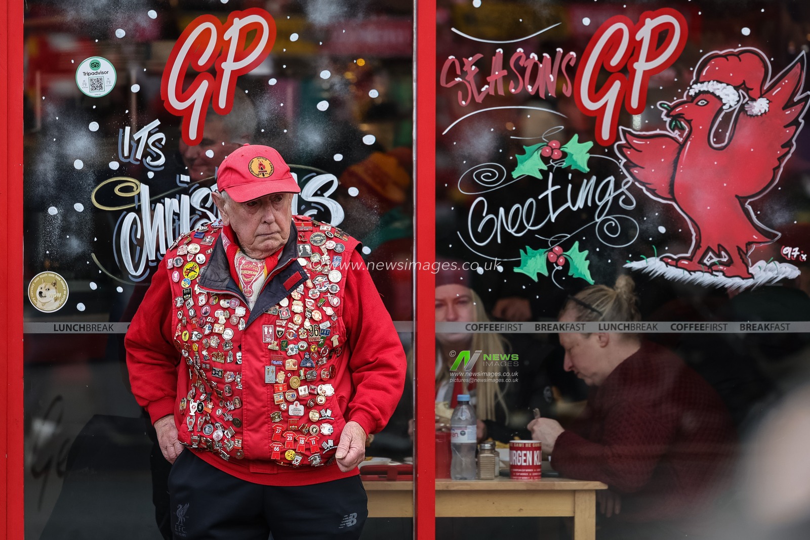 A Liverpool fan with his coat covered in pin badges during the Premier League match Liverpool vs Wolverhampton Wanderers at Anfield, Liverpool, United Kingdom, 27th December 2025

(Photo by Mark Cosgrove/News Images)

*** GER AUT SUI OUT ***