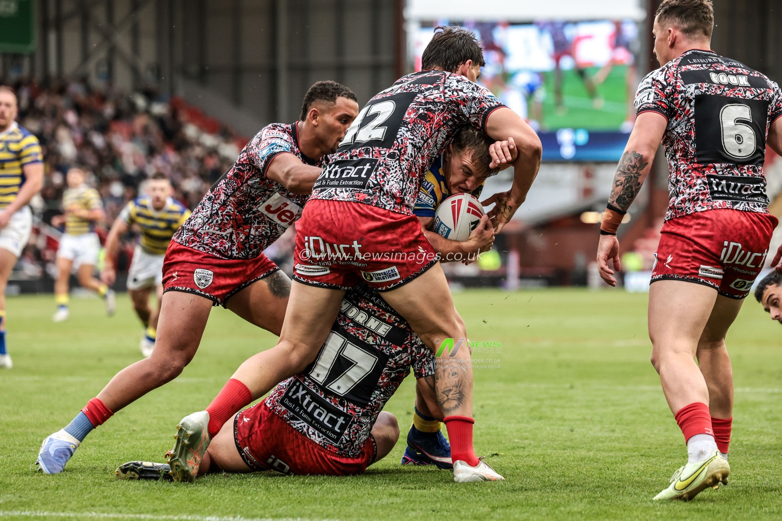 Leon Hayes of Warrington Wolves is tackled by Owen Trout of Leigh Leopards and Liam Horne of Leigh Leopards during the Betfred Super League round 20 match Leigh Leopards vs Warrington Wolves at Leigh Sports Village, Leigh, United Kingdom on 25 July 2026

(Photo by Alfie Cosgrove/News Images)