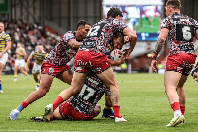 Leon Hayes of Warrington Wolves is tackled by Owen Trout of Leigh Leopards and Liam Horne of Leigh Leopards during the Betfred Super League round 20 match Leigh Leopards vs Warrington Wolves at Leigh Sports Village, Leigh, United Kingdom on 25 July 2026

(Photo by Alfie Cosgrove/News Images)