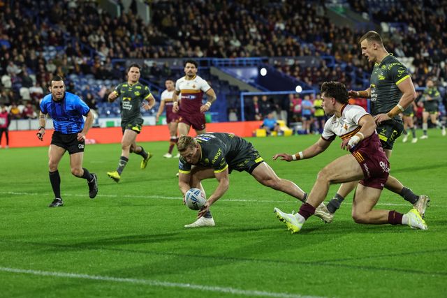 Lachie Miller of Leeds Chinos goes over for a try during the Betfred Super League round 8 match Huddersfield Giants vs Leeds Rhinos at Accu Stadium, Huddersfield, United Kingdom on 17 April 2026

(Photo by Mark Cosgrove/News Images)