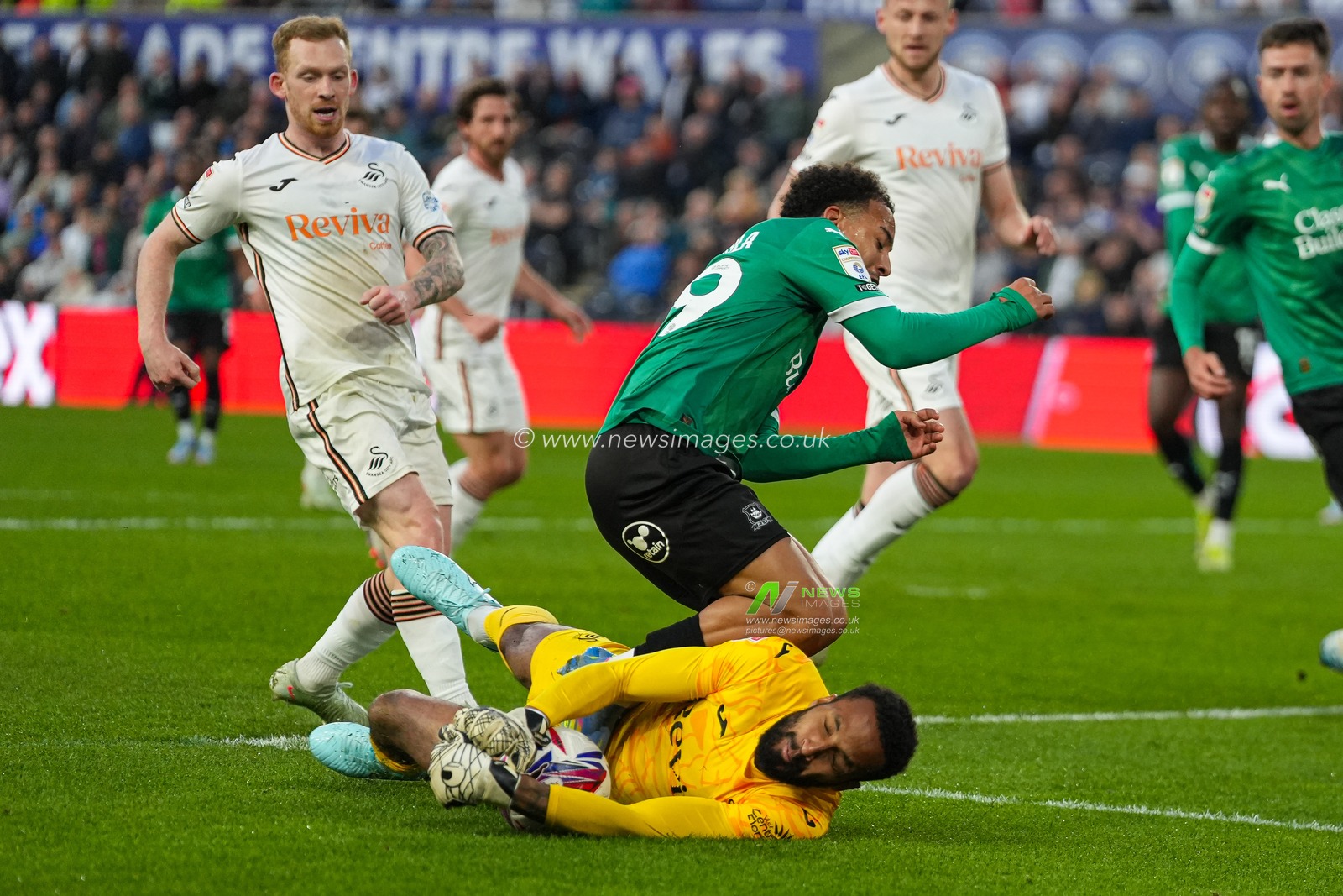 Swansea City goalkeeper Lawrence Vigouroux saves from Matthew Sorinola of Plymouth Argyle during the Sky Bet Championship match Swansea City vs Plymouth Argyle at Swansea.com Stadium, Swansea, United Kingdom, 9th April 2025

(Photo by Andrew Lewis/News Images)