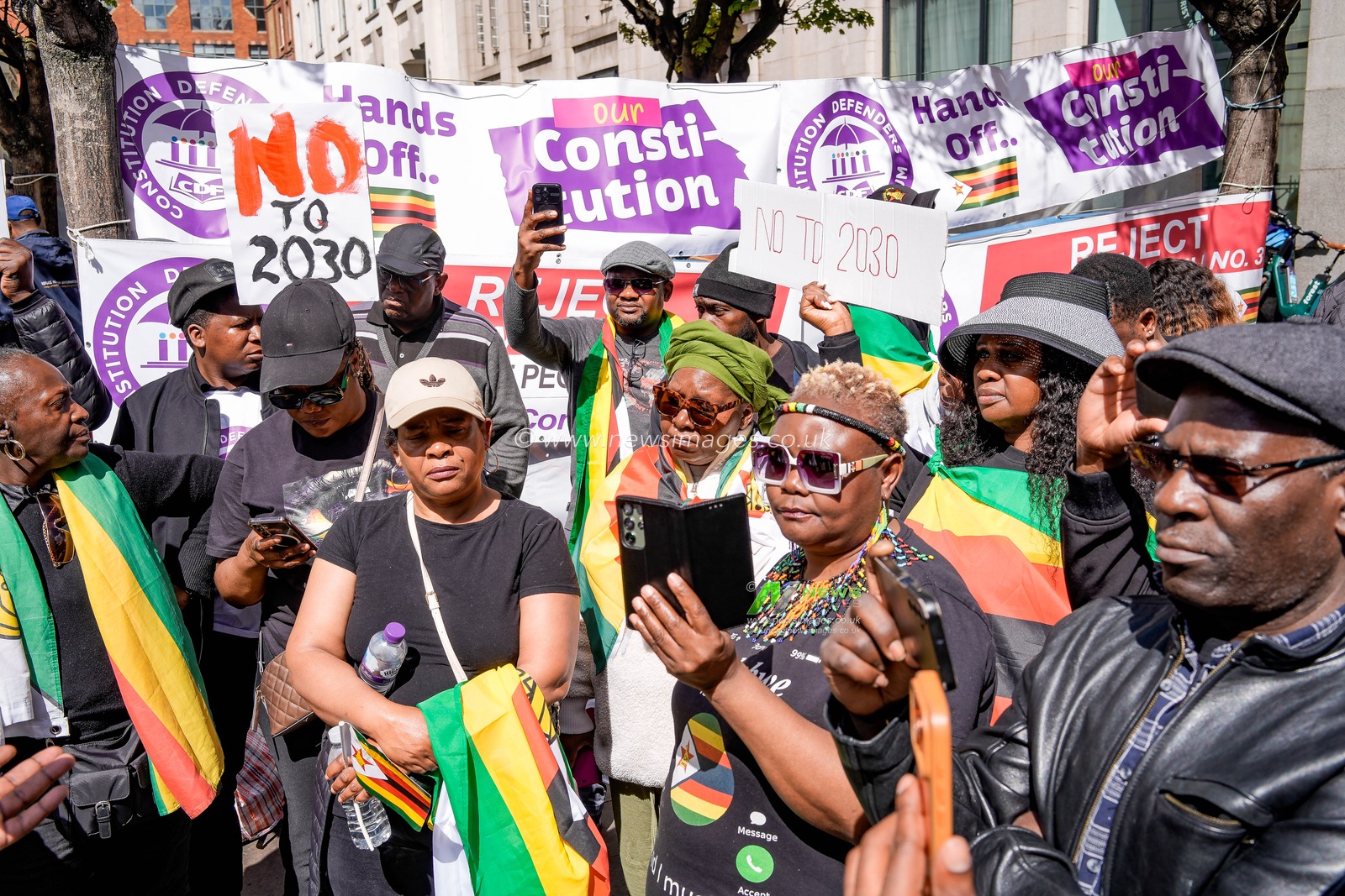 UK-based Zimbabweans gather outside the Zimbabwe Embassy in London on 18 April 2026 to protest the Constitution of Zimbabwe Amendment (No. 3) Bill, which critics say would extend President Mnangagwa’s rule until 2030 and strip citizens of the direct vote for president.

(Photo by Maynard Manyowa/News Images)