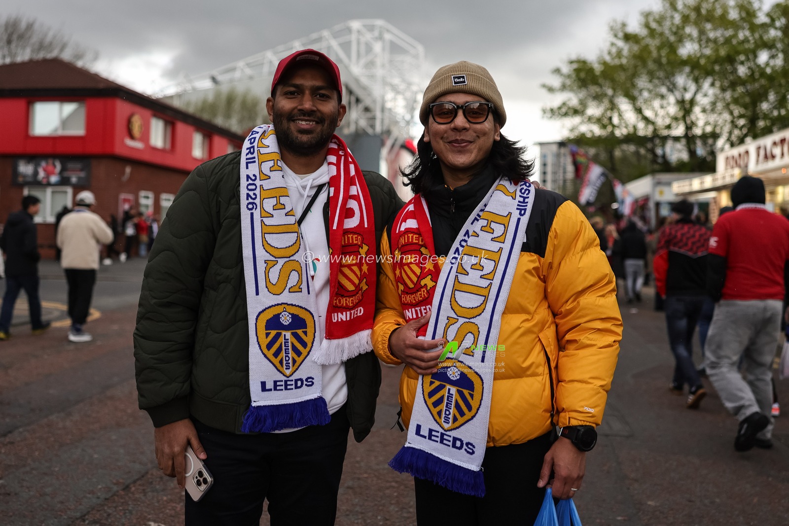 Fans make their way to the game wearing Manchester United v Leeds United scarfs during the Premier League match Manchester United vs Leeds United at Old Trafford, Manchester, United Kingdom on 13 April 2026

(Photo by Mark Cosgrove/News Images)
