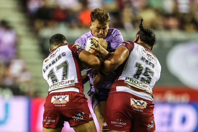 Jai Whitbread of Hull KR is tackled during the Betfred Super League round 22 match Wigan Warriors vs Hull KR at The Brick Community Stadium, Wigan, United Kingdom, 15th August 2025

(Photo by Alfie Cosgrove/News Images)