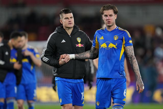 Jake Bijol of Leeds United and Joe Rodon of Leeds United at full time during the Premier League match Brentford vs Leeds United at The Gtech Community Stadium, London, United Kingdom, 14th December 2025

(Photo by Harvey Murphy/News Images)

*** GER AUT SUI OUT ***