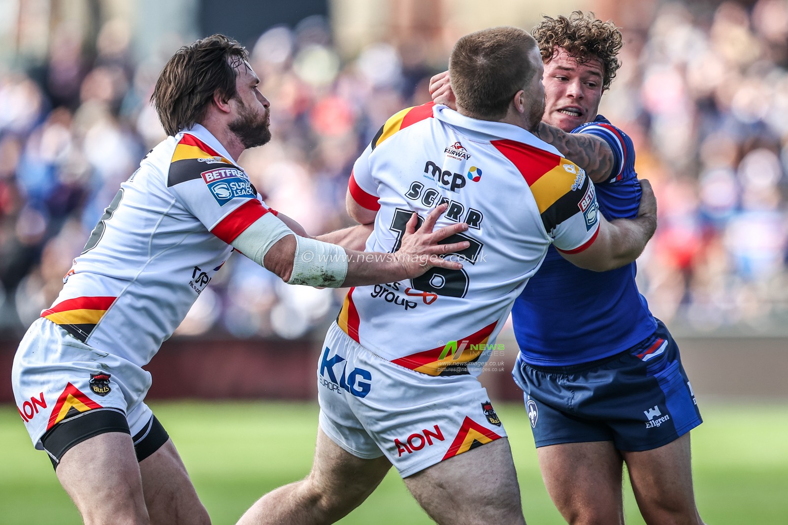 Harvey Smith of Wakefield Trinity is tackled by Ebon Scurr of Bradford Bulls during the Betfred Super League round 8 match Wakefield Trinity vs Bradford Bulls at DIY Kitchens Stadium, Wakefield, United Kingdom on 18 April 2026

(Photo by Alfie Cosgrove/News Images)