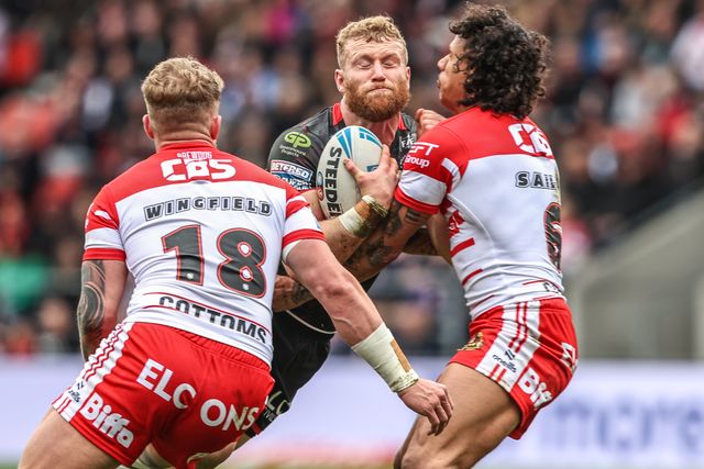 Luke Thompson of Wigan Warriors is tackled by Tristan Sailor of St Helens during the Betfred Super League round 7 match St Helens vs Wigan Warriors at The BrewDog Stadium, St Helens, United Kingdom on 03 April 2026

(Photo by Alfie Cosgrove/News Images)