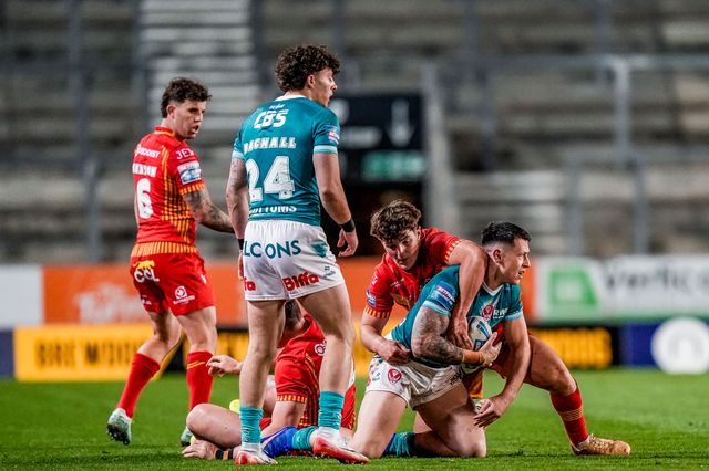 George Delaney of St Helens is tackled by ,Toby Sexton during the Betfred Challenge Cup Quarter Final match St Helens vs Catalans Dragons at The BrewDog Stadium, St Helens, United Kingdom on 10 April 2026

(Photo by Maynard Manyowa/News Images)