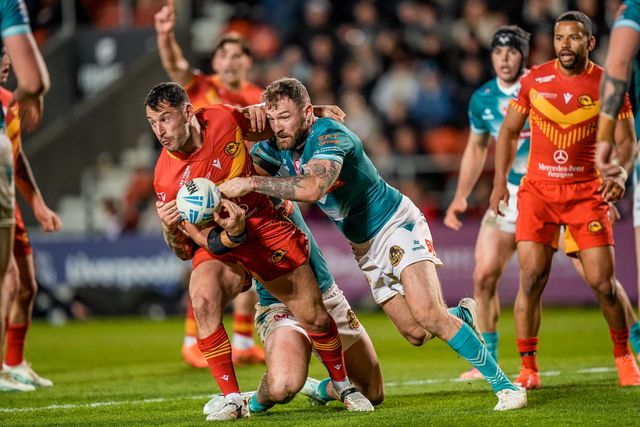 Benjamin Garcia of Catalans Dragons is tackled by George Delaney of St Helens during the Betfred Challenge Cup Quarter Final match St Helens vs Catalans Dragons at The BrewDog Stadium, St Helens, United Kingdom on 10 April 2026

(Photo by Maynard Manyowa/News Images)