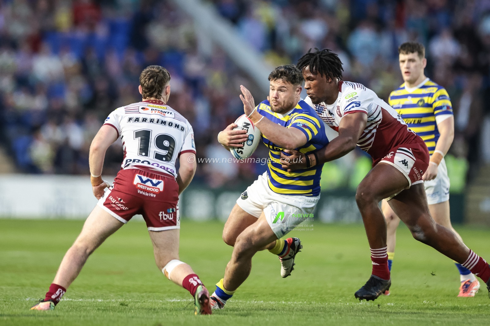 Joe Philbin of Warrington Wolves is tackled by Junior Nsemba of Wigan Warriors during the Betfred Super League round 9 match Warrington Wolves vs Wigan Warriors at The Halliwell Jones Stadium, Warrington, United Kingdom on 24 April 2026

(Photo by Mark Cosgrove/News Images)