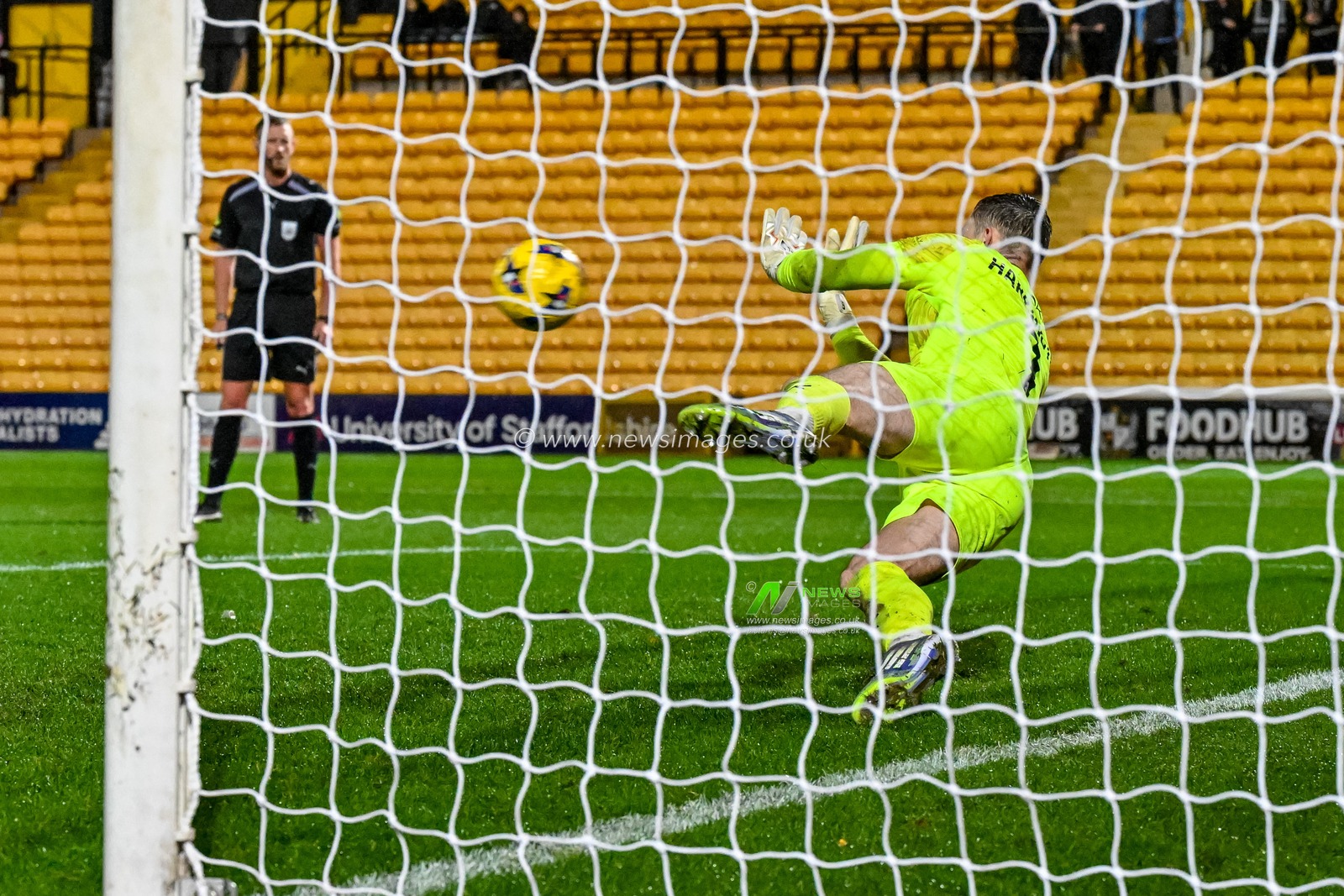 David Harrington of Fleetwood Town  saves the first penalty in the penalty shootout during the The Vertu Trophy Group G match Port Vale vs Fleetwood Town at Vale Park, Burslem, United Kingdom, 11th November 2025

(Photo by Adam Gee/News Images)

*** GER AUT SUI OUT ***