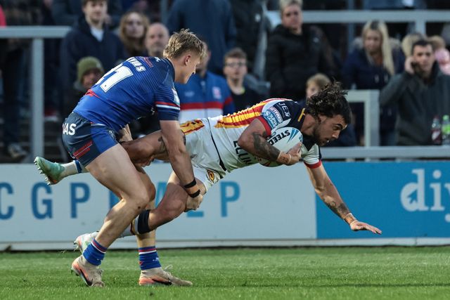 Charlie Staines of Catalans Dragons is tackled by Jayden Myers of Wakefield Trinity during the Betfred Super League round 11 match Wakefield Trinity vs Catalans Dragons at DIY Kitchens Stadium, Wakefield, United Kingdom on 15 May 2026

(Photo by Mark Cosgrove/News Images)