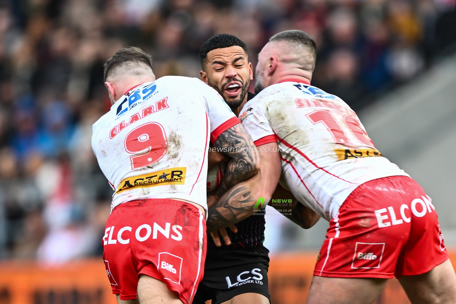 Kruise Leeming of Wigan Warriors is tackled by Daryl Clark of St. Helens and Curtis Sironen of St. Helens during the Betfred Super League Round 6 match St Helens vs Wigan Warriors at Totally Wicked Stadium, St Helens, United Kingdom, 29th March 2024

(Photo by Craig Thomas/News Images)