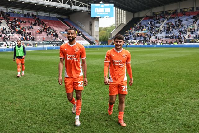 CJ Hamilton of Blackpool and Rob Apter of Blackpool after the final whistle during the Sky Bet League 1 match Wigan Athletic vs Blackpool at The Brick Community Stadium, Wigan, United Kingdom, 26th April 2025

(Photo by Mark Cosgrove/News Images)
