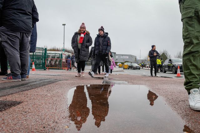 Stoke City fans walk past a puddle prior to kick off as the rain stops for a while during the Emirates FA Cup 4th Round  match Stoke City vs Fulham at Bet365 Stadium, Stoke On Trent, United Kingdom on 15 February 2026

(Photo by Maynard Manyowa/News Images)