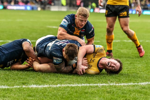 Tom Weaver of Castleford Tigers is tackled by Lachie Miller of Leeds Rhinos on the try line during the Betfred Super League round 4 match Leeds Rhinos vs Castleford Tigers at AMT Headingley Stadium, Leeds, United Kingdom on 08 March 2026

(Photo by Alfie Cosgrove/News Images)