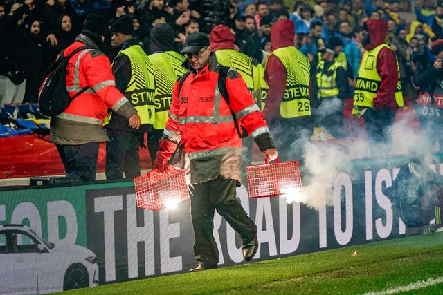 Stewards battle to contain flares thrown on to the pitch prior to kick off during the UEFA Europa League 
Knockout Round Play-offs match Nottingham Forest vs Fenerbahce at City Ground, Nottingham, United Kingdom on 26 February 2026

(Photo by Maynard Manyowa/News Images)