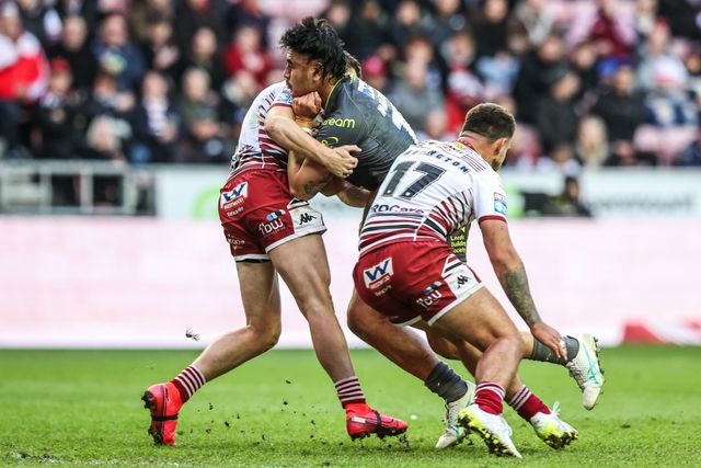 Keenan Palasia of Leeds Rhinos is tackled by Oliver Partington of Wigan Warriors during the Betfred Super League round 11 match Wigan Warriors vs Leeds Rhinos at The Brick Community Stadium, Wigan, United Kingdom on 15 May 2026

(Photo by Alfie Cosgrove/News Images)