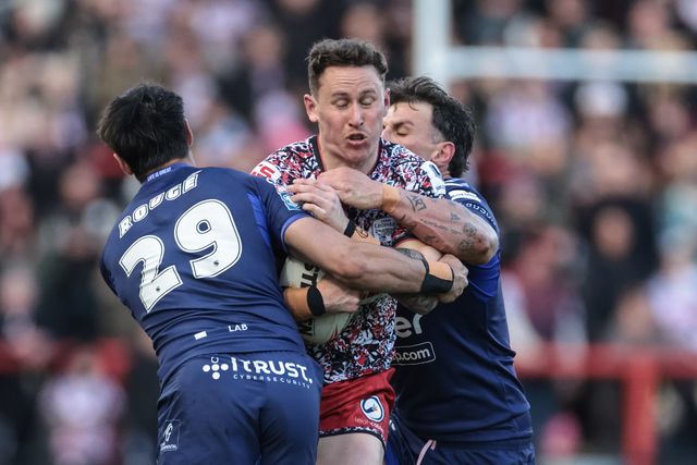 Adam Cook of Leigh Leopards is tackled by César Rougé of Toulouse Olympique during the Betfred Super League round 6 match Leigh Leopards vs Toulouse at Leigh Sports Village, Leigh, United Kingdom on 28 March 2026

(Photo by Mark Cosgrove/News Images)