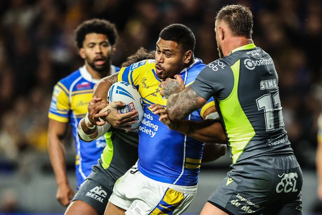 Sam Lisone of Leeds Rhinos is tackled during the Betfred Super League round 26 match Leeds Rhinos vs Catalans Dragons at Headingley Stadium, Leeds, United Kingdom, 11th September 2025

(Photo by Alfie Cosgrove/News Images)