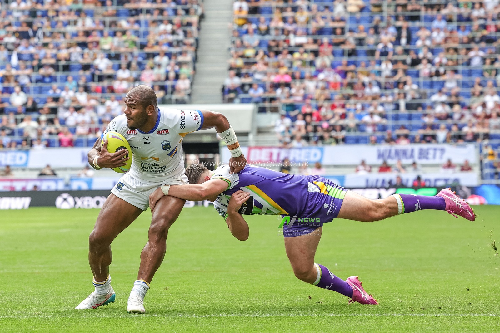 Maika Sivo of Leeds Rhinos hands-off Ethan Ryan of Bradford Bulls during the Betfred Super League Magic Weekend match Leeds Rhinos vs Bradford Bulls at Hill Dickinson Stadium, Liverpool, United Kingdom on 05 July 2026

(Photo by Mark Cosgrove/News Images)
