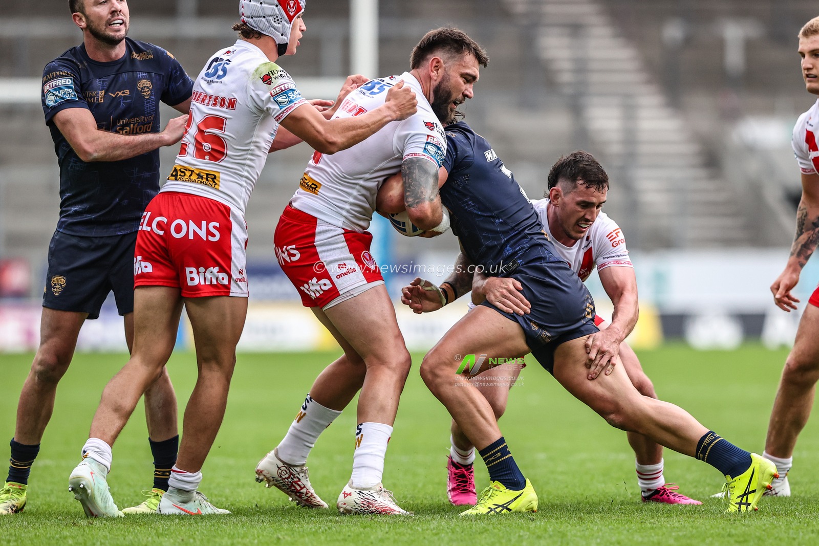 Chris Hankinson of Salford Red Devils is tackled by Kyle Feldt of St. Helens during the Betfred Super League round 16 match St Helens vs Salford Red Devils at Totally Wicked Stadium, St Helens, United Kingdom, 29th June 2025

(Photo by Alfie Cosgrove/News Images)