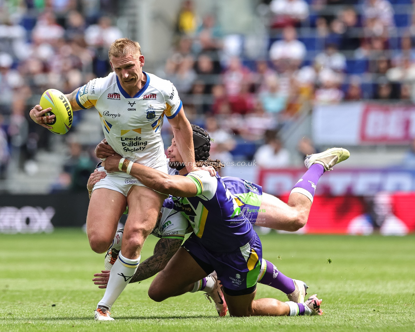 Mikolaj Oledzki of Leeds Rhinos is tackled by Guy Armitage of Bradford Bulls during the Betfred Super League Magic Weekend match Leeds Rhinos vs Bradford Bulls at Hill Dickinson Stadium, Liverpool, United Kingdom on 05 July 2026

(Photo by Mark Cosgrove/News Images)