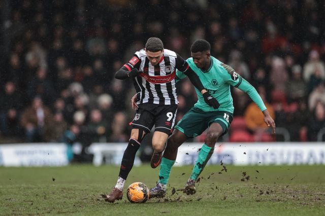 Jaze Kabia of Grimsby Town is tackled by Yerson Mosquera of Wolverhampton Wanderers during the Emirates FA Cup 4th Round match Grimsby Town vs Wolverhampton Wanderers at Blundell Park, Cleethorpes, United Kingdom on 15 February 2026

(Photo by Mark Cosgrove/News Images)