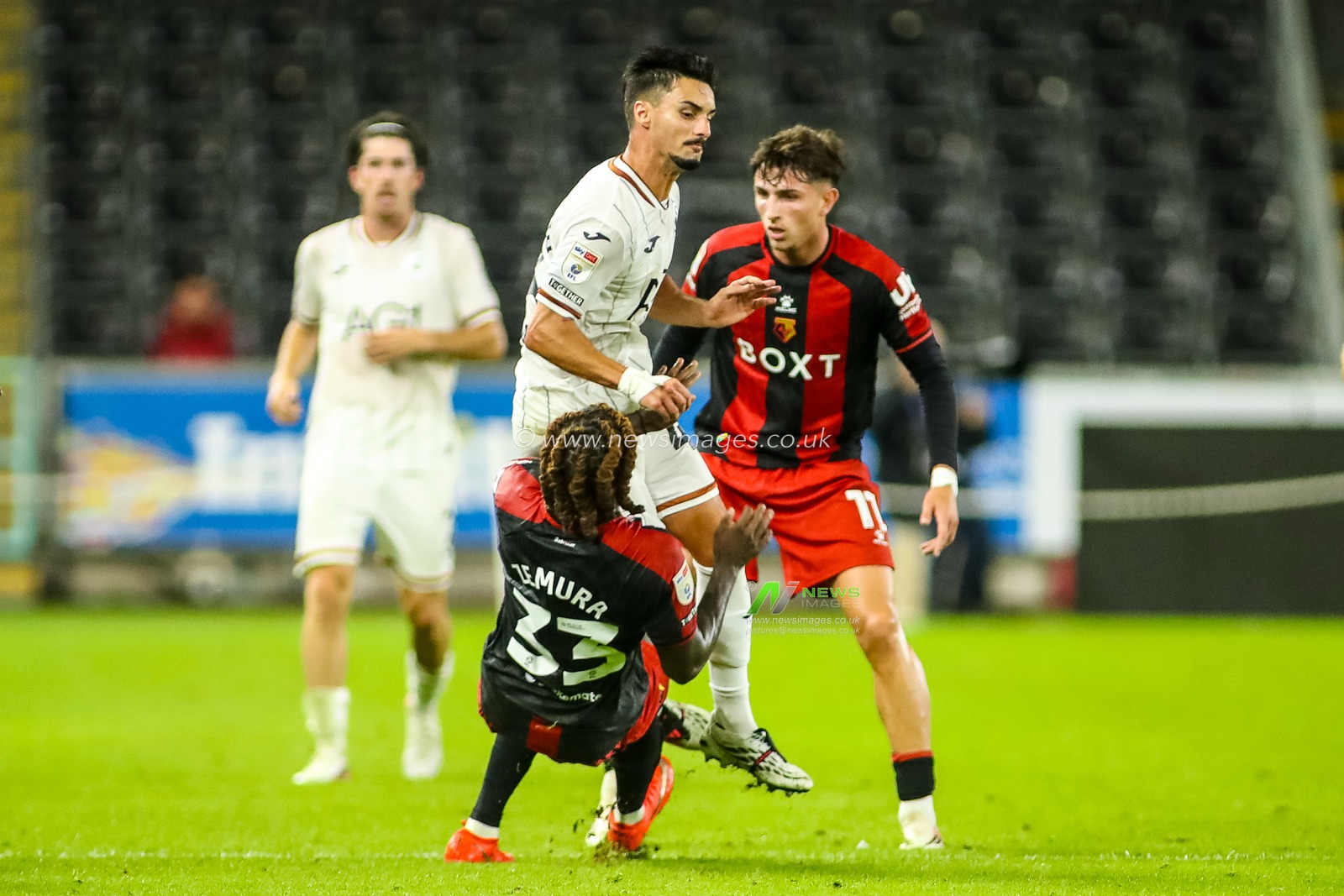 Stephen Eustaquio of Swansea City is fouled by Jordan Zemura of Watford during the Sky Bet Championship match Swansea City vs Watford at Swansea.com Stadium, Swansea, United Kingdom on 01 September 2026

(Photo by Andrew Lewis/News Images)
