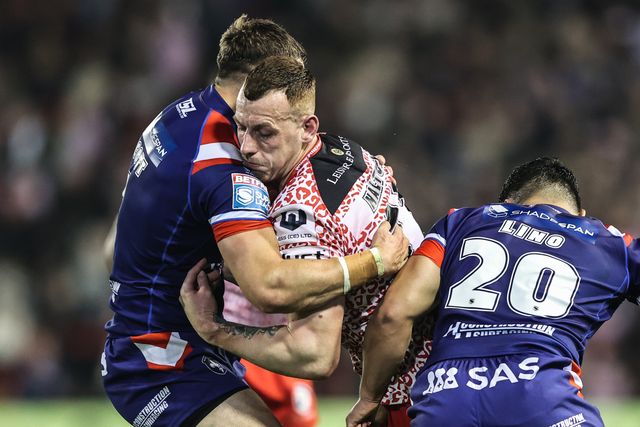 Frankie Halton of Leigh Leopards is tackled by Cam Scott of Wakefield Trinity during the Betfred Super League play-off Eliminator 1 match Leigh Leopards vs Wakefield Trinity at Progress With Unity Stadium, Leigh, United Kingdom, 26th September 2025

(Photo by Alfie Cosgrove/News Images)