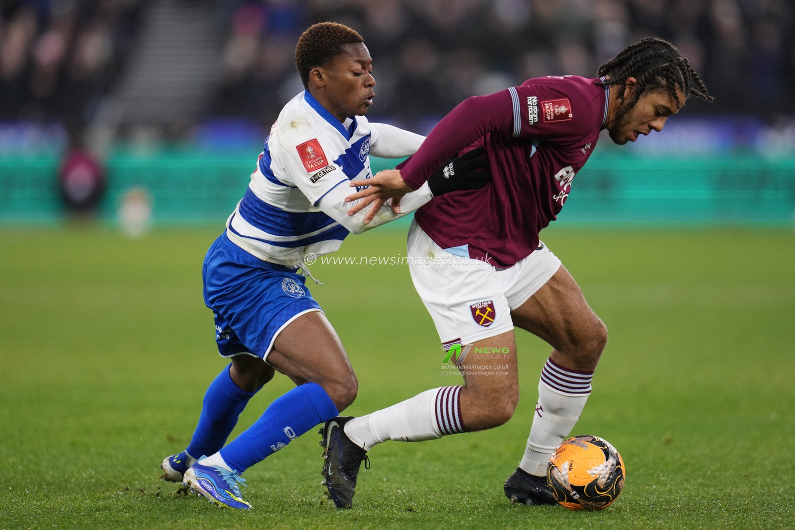 Ezra Mayers of West Ham United and Karamoko Dembélé of Queens Park Rangers battle during the Emirates FA Cup Third Round match West Ham United vs Queens Park Rangers at London Stadium, London, United Kingdom, 11th January 2026

(Photo by Harvey Murphy/News Images)