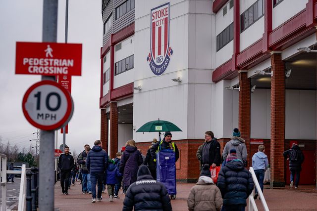 Fans walk past a steward selling the official match day programs during the Emirates FA Cup 4th Round  match Stoke City vs Fulham at Bet365 Stadium, Stoke On Trent, United Kingdom on 15 February 2026

(Photo by Maynard Manyowa/News Images)