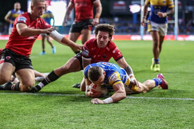 Harry Newman of Leeds Rhinos goes over for a try during the Betfred Super League round 19 match Leeds Rhinos vs Salford Red Devils at Headingley Stadium, Leeds, United Kingdom, 18th July 2025

(Photo by Alfie Cosgrove/News Images)