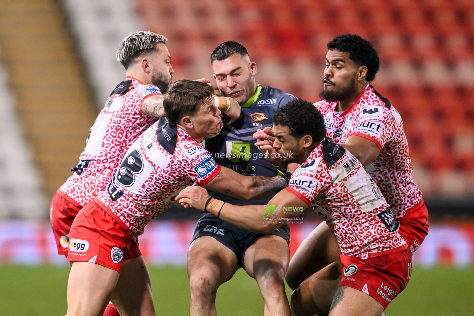 Nick Cotric of Catalan Dragons is gang tackled by the Leigh Leopards defence during the Betfred Super League Round 3 match Leigh Leopards vs Catalans Dragons at Leigh Sports Village, Leigh, United Kingdom, 28th February 2025

(Photo by Craig Thomas/News Images)