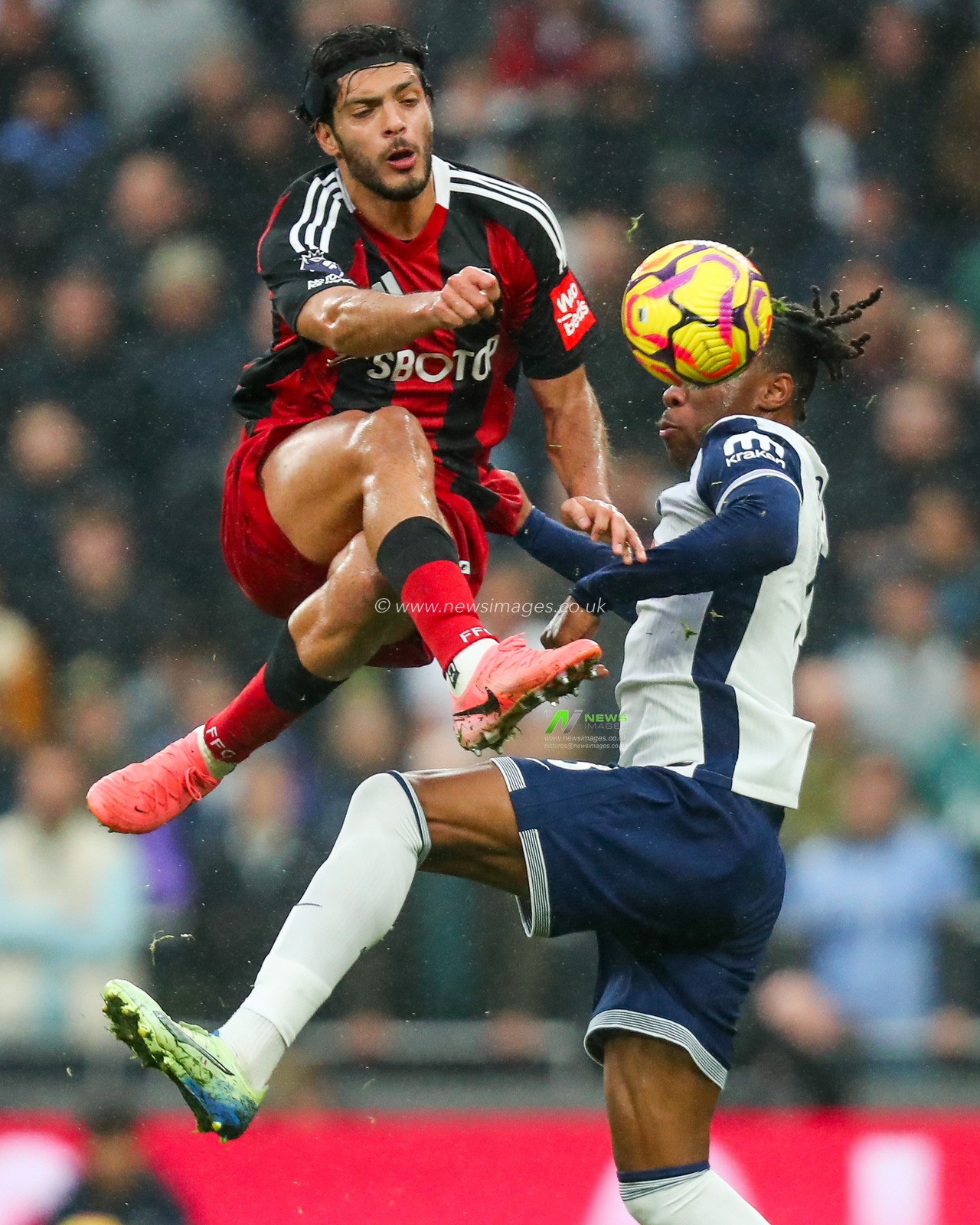 Raul Jimenez of Fulham battles for the ball with Destiny Udogie of Tottenham Hotspur during the Premier League match Tottenham Hotspur vs Fulham at Tottenham Hotspur Stadium, London, United Kingdom, 1st December 2024

(Photo by Izzy Poles/News Images)