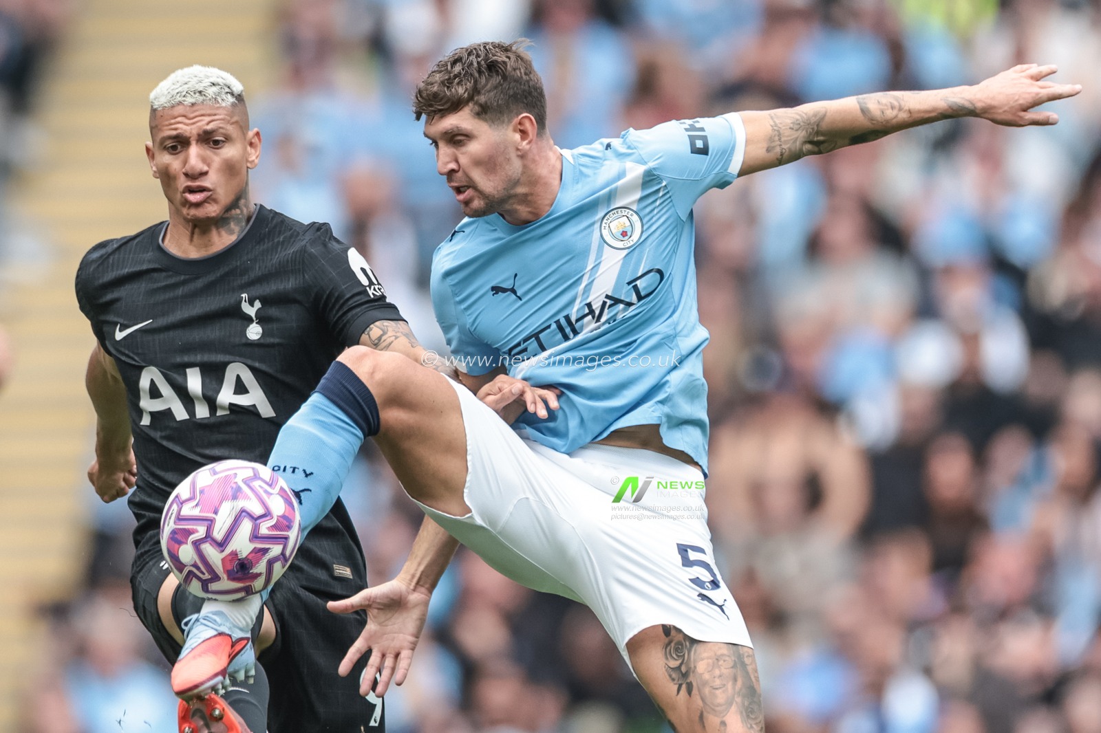 John Stones of Manchester City wins the ball pressured by Richarlison of Tottenham Hotspur during the Premier League match Manchester City vs Tottenham Hotspur at Etihad Stadium, Manchester, United Kingdom, 23rd August 2025

(Photo by Mark Cosgrove/News Images)