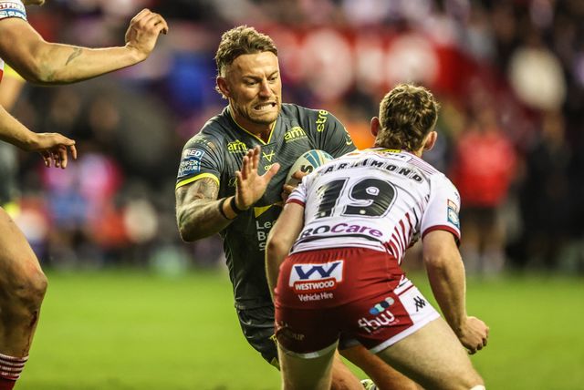 Chris Hankinson of Leeds Rhinos is tackled by Jack Farrimond of Wigan Warriors during the Betfred Super League round 11 match Wigan Warriors vs Leeds Rhinos at The Brick Community Stadium, Wigan, United Kingdom on 15 May 2026

(Photo by Alfie Cosgrove/News Images)