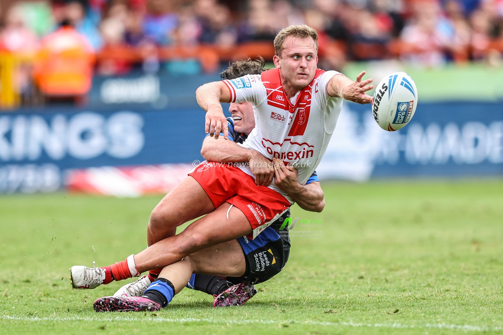Jez Litten of Hull KR passes the ball back as he is tackled during the Betfred Super League round 17 match Hull KR vs Leeds Rhinos at Sewell Group Craven Park, Kingston upon Hull, United Kingdom, 6th July 2025

(Photo by Alfie Cosgrove/News Images)