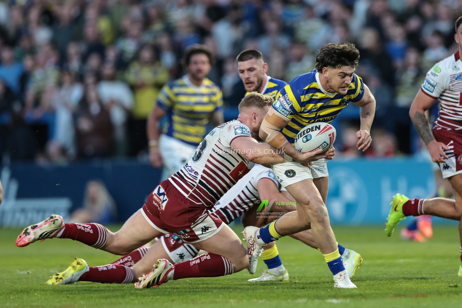 Jordan Crowther of Warrington Wolves is tackled during the Betfred Super League round 9 match Warrington Wolves vs Wigan Warriors at The Halliwell Jones Stadium, Warrington, United Kingdom on 24 April 2026

(Photo by Mark Cosgrove/News Images)