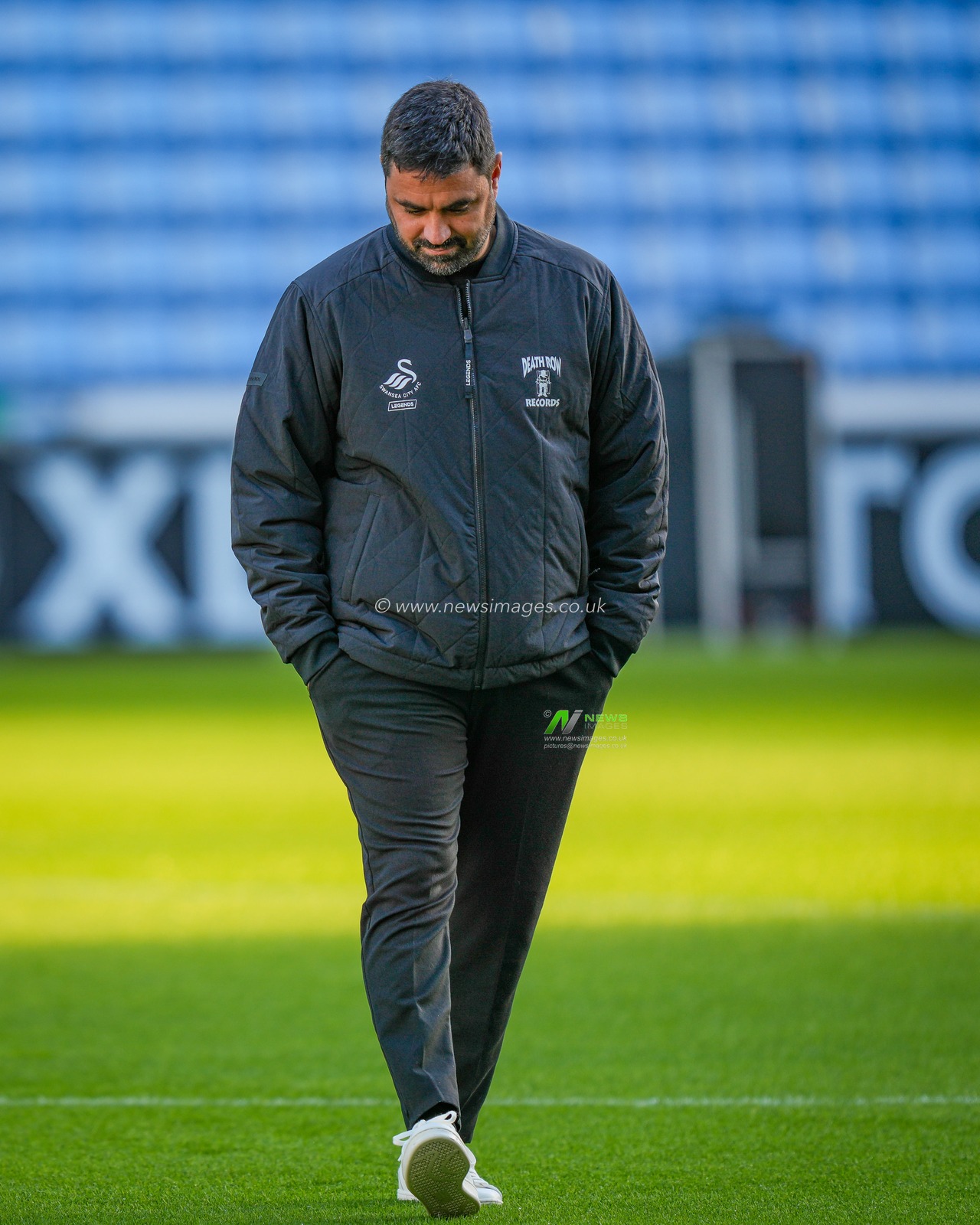 Swansea City Manager Vítor Matos inspects the pitch during the Sky Bet Championship match Coventry City vs Swansea City at Coventry Building Society Arena, Coventry, United Kingdom, 26th December 2025

(Photo by Maynard Manyowa/News Images)

*** GER AUT SUI OUT ***