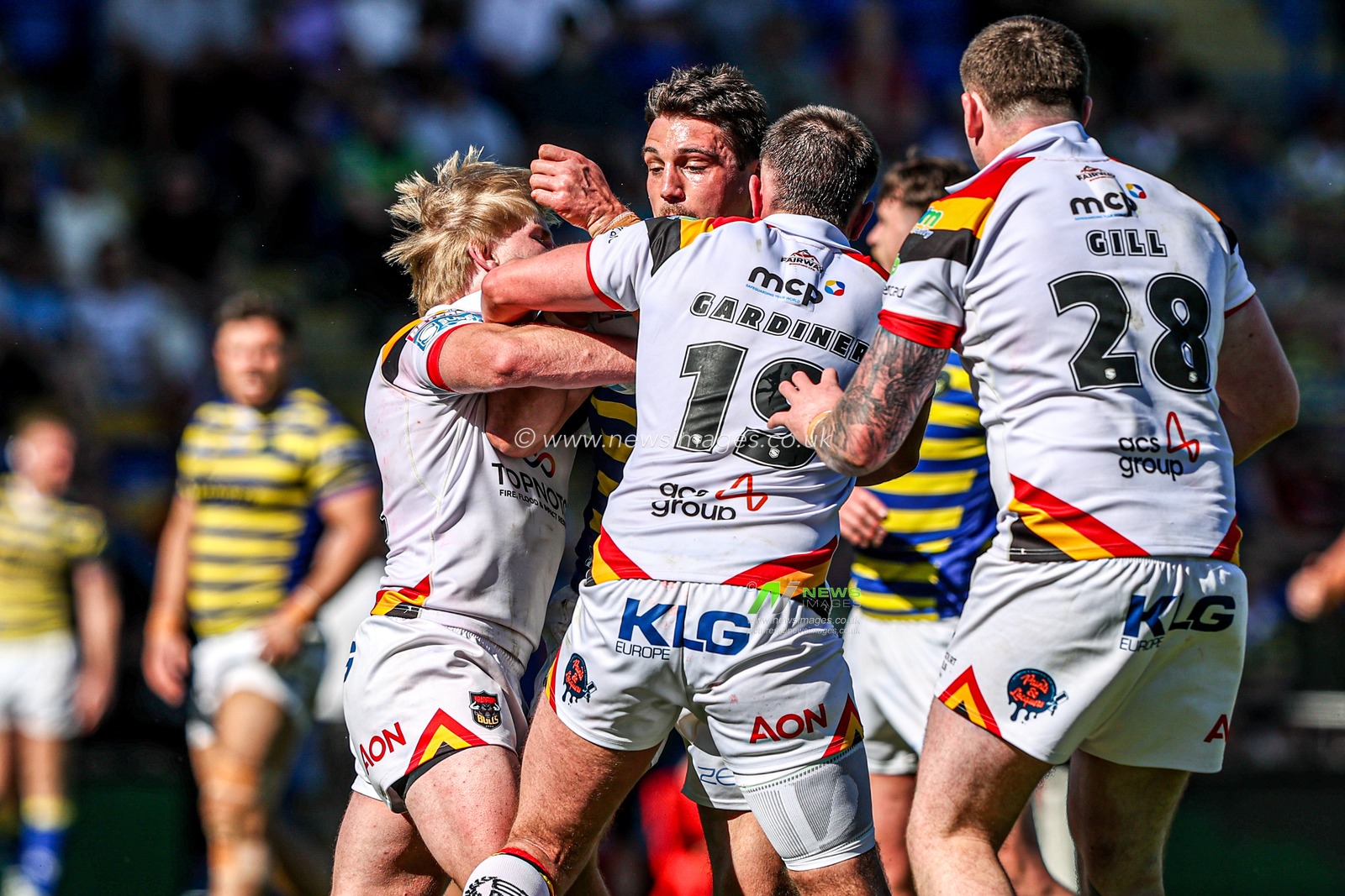 Liam Byrne of Warrington Wolves is tackled by Will Gardiner of Bradford Bulls and Mitch Souter of Bradford Bulls during the Betfred Super League round 12 match Warrington Wolves vs Bradford Bulls at The Halliwell Jones Stadium, Warrington, United Kingdom on 24 May 2026

(Photo by Alfie Cosgrove/News Images)